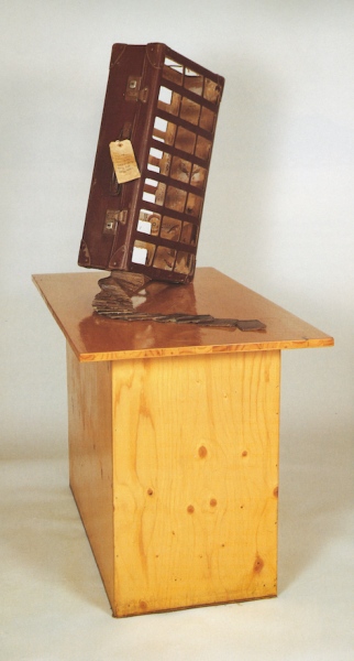 Twist (1989) 1300 x 560 x 980 mm. Suitcase, wood, bolts, lock, varnish, ink. Collection Belfast Media Group &amp;nbsp; &amp;nbsp;&amp;nbsp;