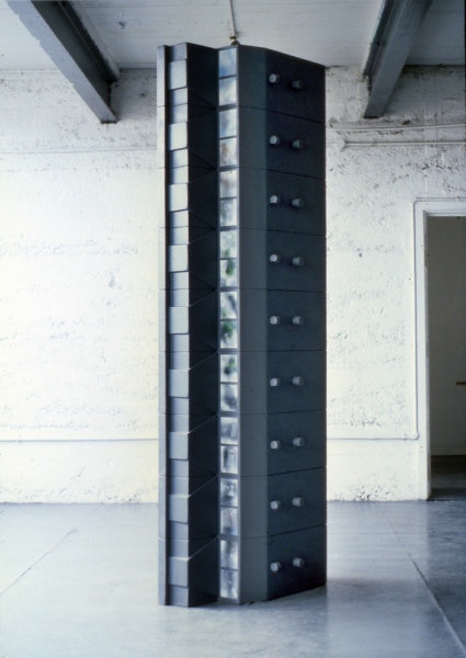 File (1988) 244 x 78 x 42 cm. Wood, paint. &amp;lsquo;&amp;hellip;Morris, too, has considered the way a systems approach is taken in army intelligence work. Works such as File and Woman of Interest are about the depersonalisation of individuals, despite building up a factual databank on them, and the distorted profile that might follow&amp;hellip;&amp;rsquo;&amp;nbsp; (text extract, The City as Art, Liam Kelly, A.I.C.A , Irish section, 1994)